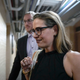 Sen. Kyrsten Sinema (D-AZ) walks to a vote at the U.S. Capitol on July 28, 2022, in Washington, DC. On Wednesday, Senate Majority Leader Chuck Schumer (D- NY) and Sen. Joe Manchin (D-WV) announced an agreement on sweeping energy and climate bill.